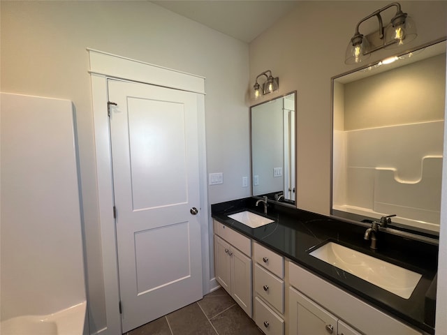 bathroom with tile patterned flooring and vanity