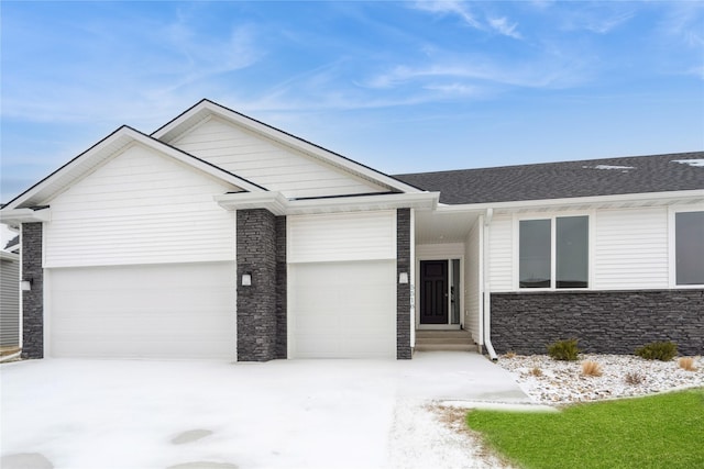 ranch-style house featuring a garage