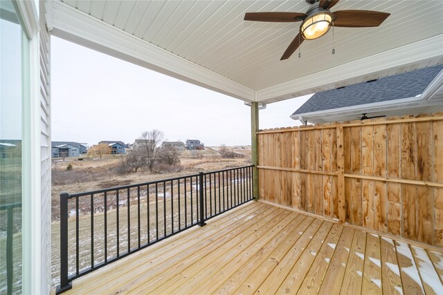 wooden terrace featuring ceiling fan