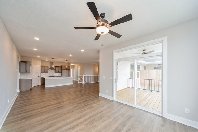 unfurnished living room featuring light hardwood / wood-style floors