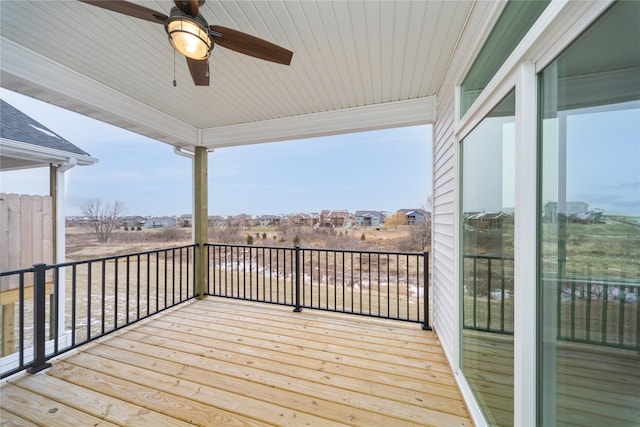 wooden terrace featuring ceiling fan