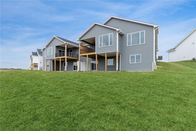 back of house featuring a yard