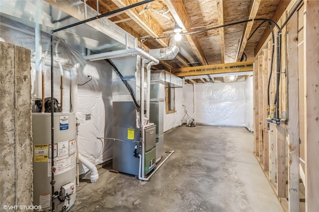 basement featuring heating unit and water heater