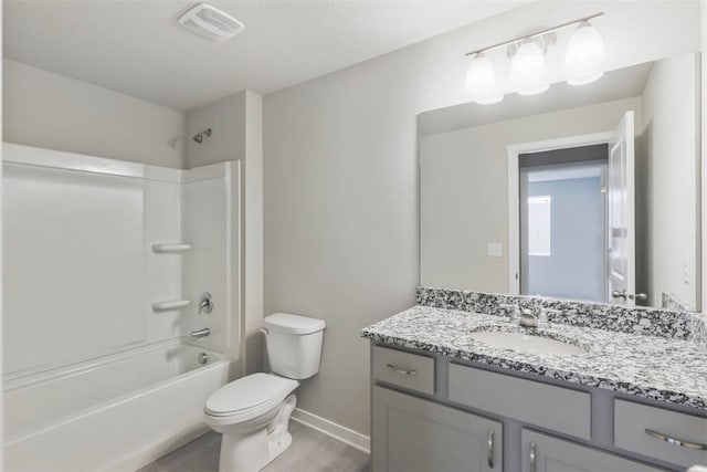 full bathroom featuring vanity, toilet, wood-type flooring, and bathtub / shower combination