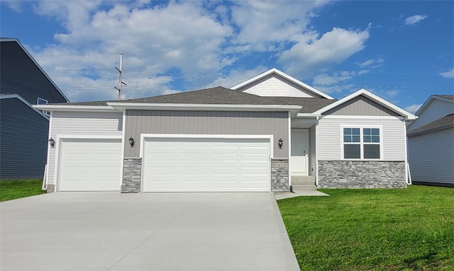 view of front facade with a front yard and a garage