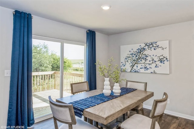 dining area with dark wood-type flooring