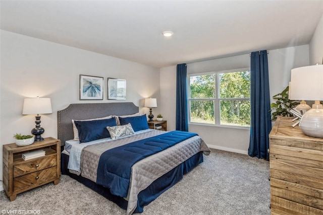 bedroom featuring light carpet