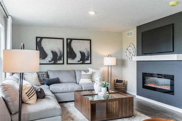 living room with dark hardwood / wood-style flooring