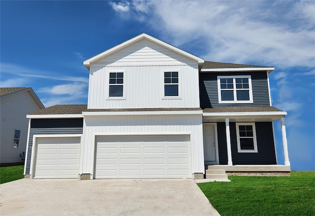 front facade with a front lawn and a garage