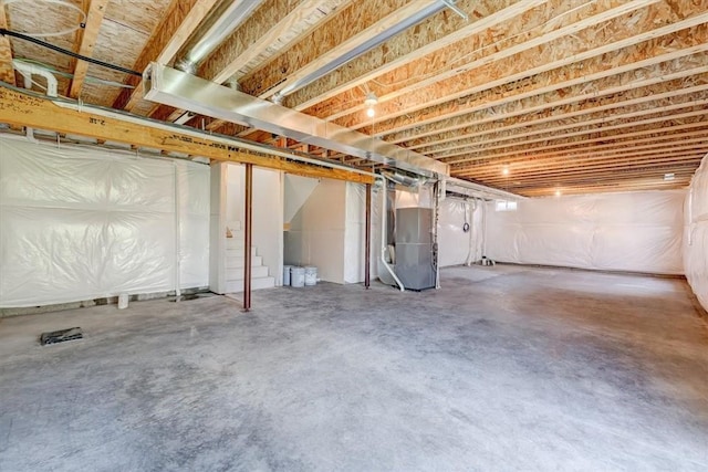 basement featuring heating unit