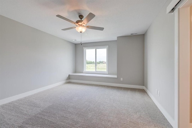 carpeted empty room with ceiling fan