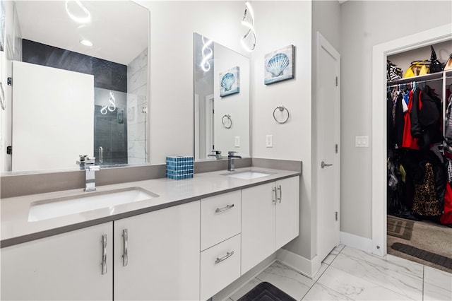 bathroom featuring double vanity, tile floors, and a shower with shower door