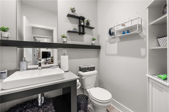 bathroom featuring toilet and vanity