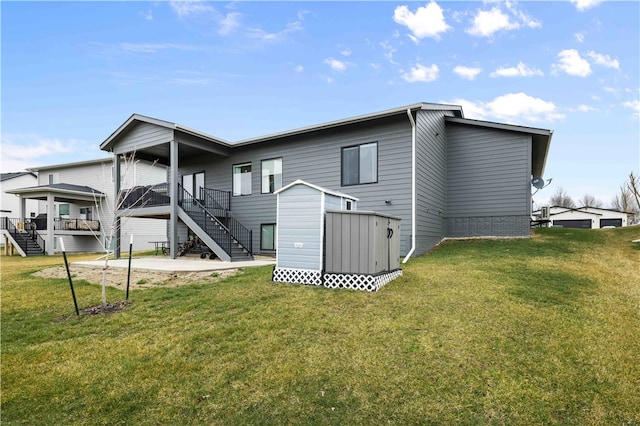 rear view of property featuring a lawn and a wooden deck