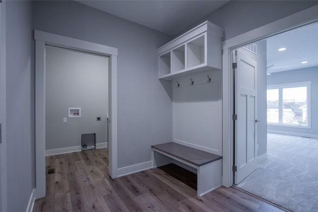 mudroom with light hardwood / wood-style floors