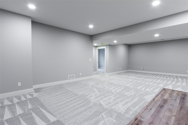 basement with light colored carpet