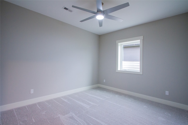 spare room featuring ceiling fan and carpet flooring