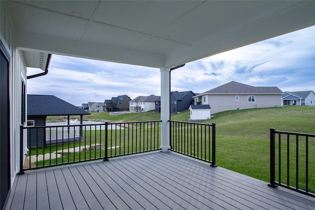 wooden deck with a lawn