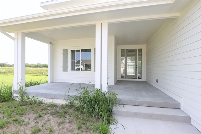 property entrance featuring covered porch