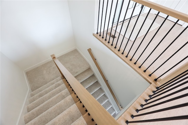 staircase with carpet floors