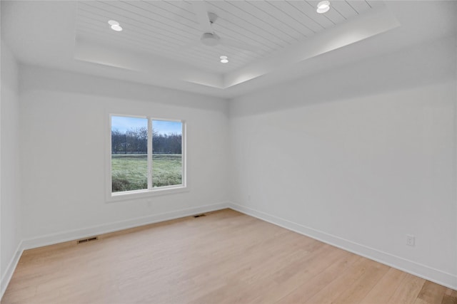 1772 Highland Cir SW, Altoona, IA 50009 - unfurnished room featuring a raised ceiling, light wood finished floors, baseboards, and recessed lighting
