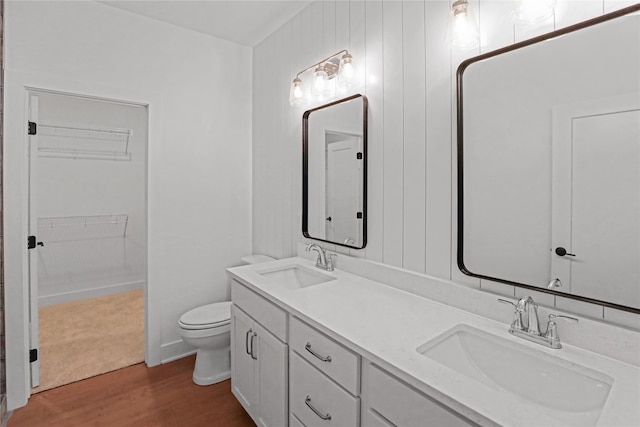 bathroom featuring hardwood / wood-style floors, vanity, and toilet