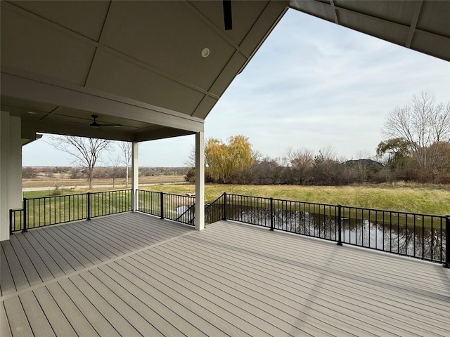 11528 NW Brookefield Ct, Grimes, IA 50111 - wooden terrace featuring a ceiling fan, a water view, and a yard