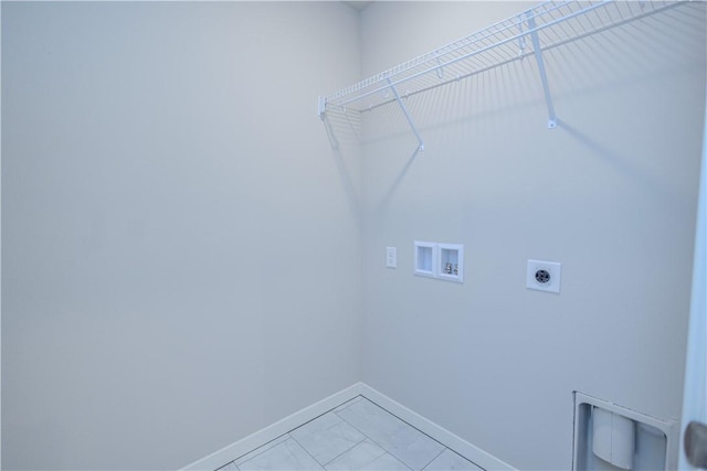 laundry area featuring hookup for an electric dryer, washer hookup, and light tile patterned floors