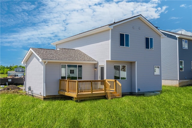 back of property featuring a yard and a deck