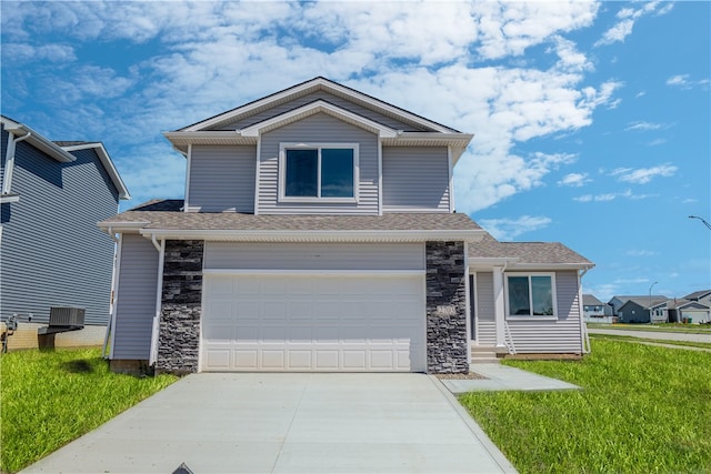 front of property with a front yard and a garage