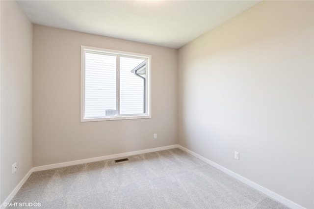 spare room featuring carpet flooring