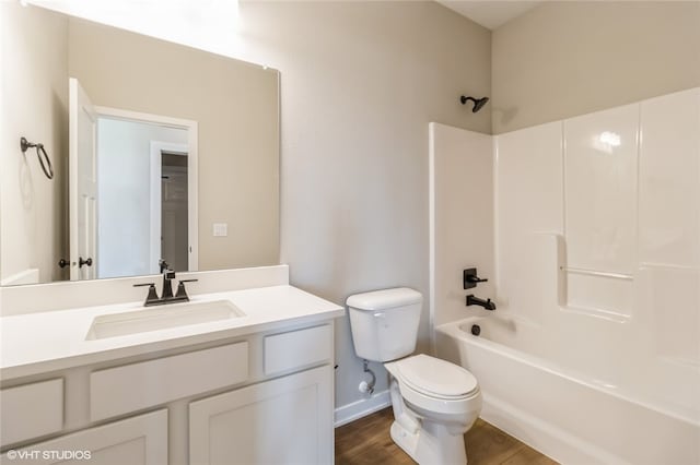 full bathroom featuring hardwood / wood-style flooring, vanity, toilet, and tub / shower combination