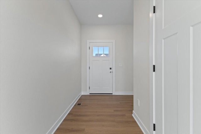 doorway to outside featuring light wood-type flooring