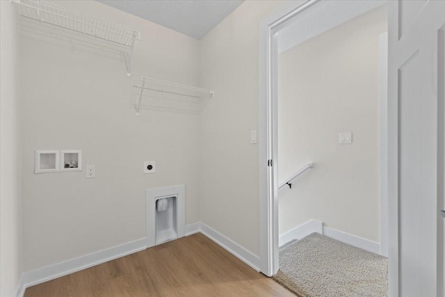 washroom featuring hookup for a washing machine, wood-type flooring, and hookup for an electric dryer