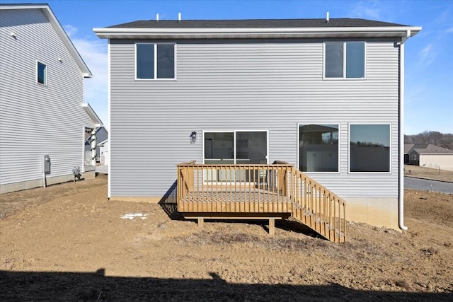 back of house featuring a wooden deck