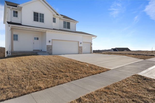 view of front facade with a garage and a front lawn