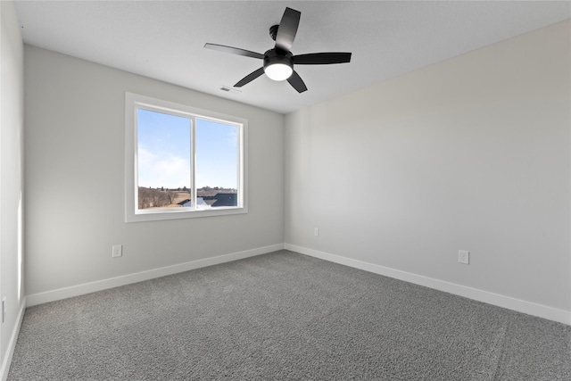 carpeted empty room with ceiling fan