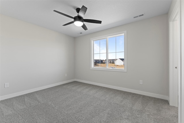 empty room with carpet floors and ceiling fan