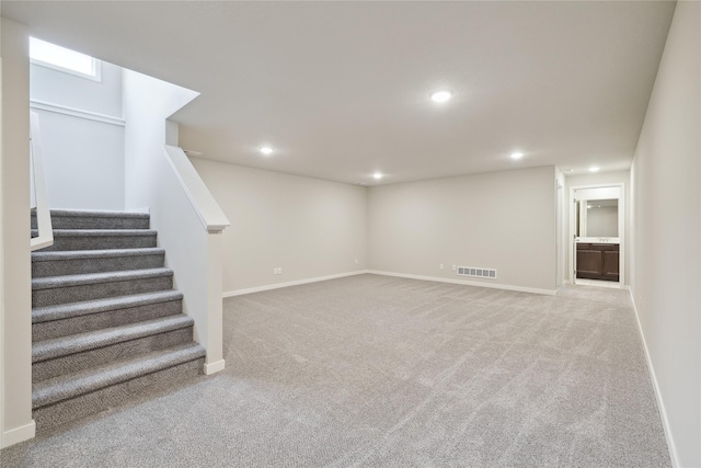 basement with light carpet