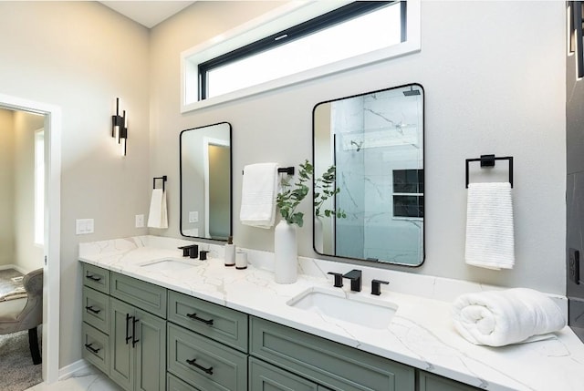 bathroom featuring walk in shower and vanity