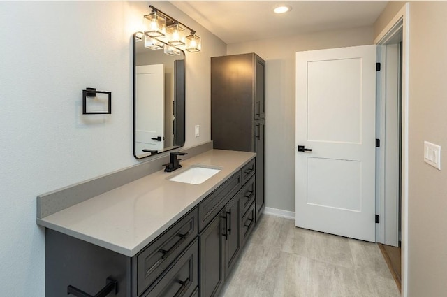 bathroom featuring vanity and hardwood / wood-style floors