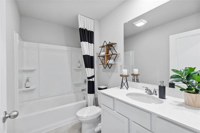 full bathroom featuring tile patterned flooring, vanity, toilet, and shower / bath combo with shower curtain