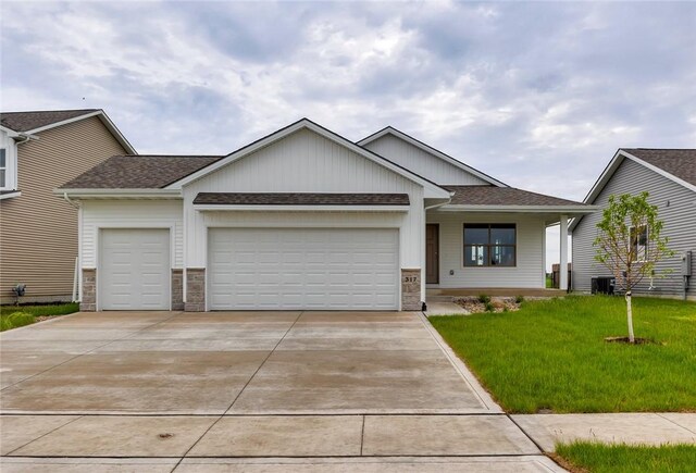 view of front facade with a garage and a front lawn