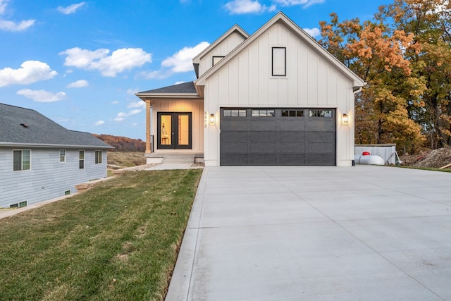 modern farmhouse featuring a front yard and french doors