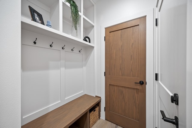 mudroom with light hardwood / wood-style floors