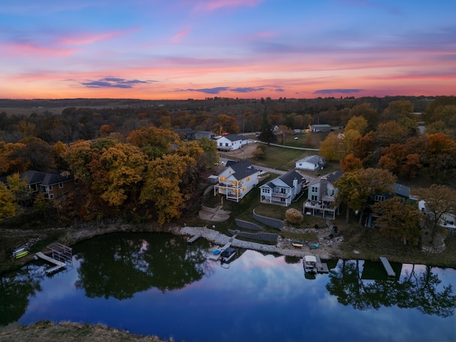 aerial view at dusk with a water view