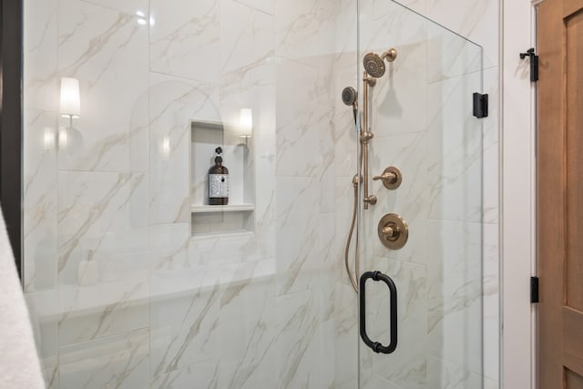 bathroom with a shower with shower door