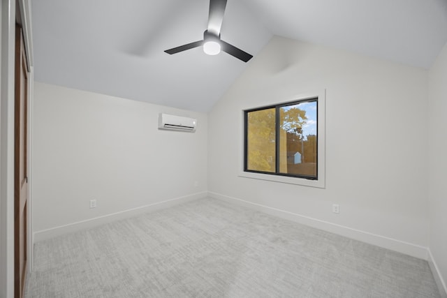 carpeted spare room featuring lofted ceiling and an AC wall unit