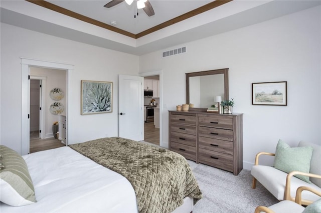 bedroom featuring light colored carpet and ceiling fan