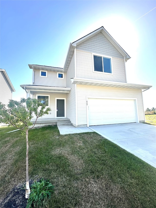 view of front of house with a garage and a front lawn